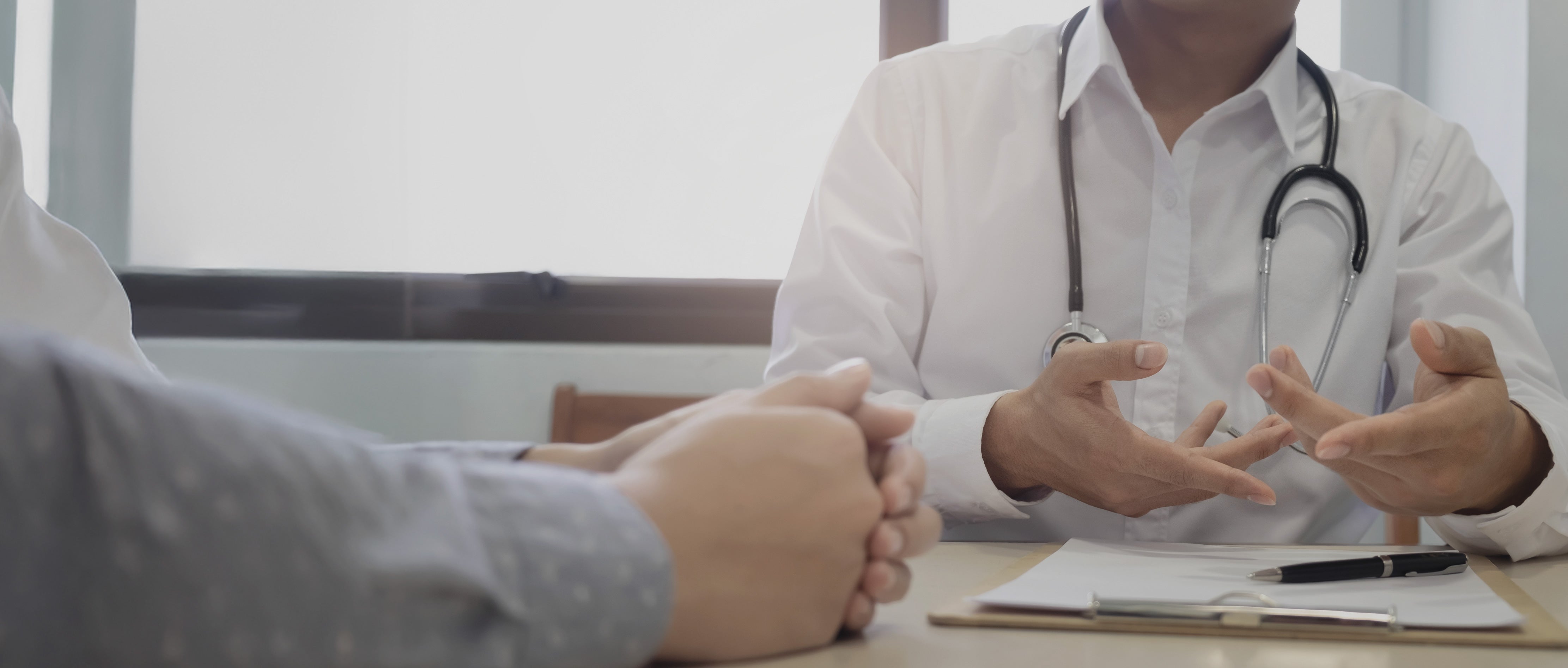 Person speaking with a doctor during a free consultation for weight management and diabetes support in Malaysia