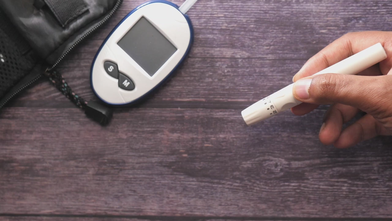 Checking blood sugar with a glucometer to monitor progress in diabetes remission
